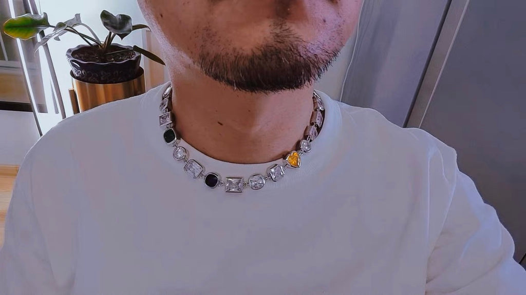Pharrell Williams grills are studded with sapphires, rubies and emeralds. INFINITY GAUNTLETS jewelry diamond choker jacob & co short necklace gemstone heart Gabby Elan Jewelry infinity stone grillz grill grills