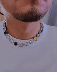 Pharrell Williams grills are studded with sapphires, rubies and emeralds. INFINITY GAUNTLETS jewelry diamond choker jacob & co short necklace gemstone heart Gabby Elan Jewelry infinity stone grillz grill grills