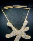 Young Thug gifted Ken Carson a custom, iced-out YSL chain featuring a diamond-covered pendant of the label's emblem.