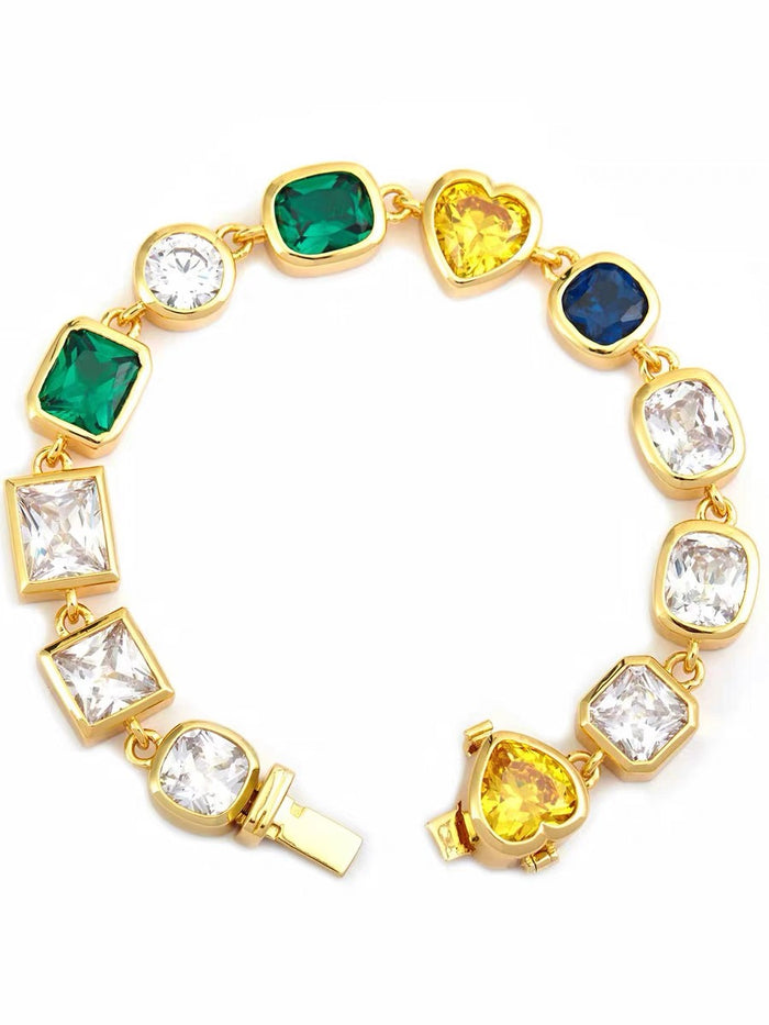 Pharrell Williams grills are studded with sapphires, rubies and emeralds. INFINITY GAUNTLETS jewelry diamond choker jacob & co short necklace gemstone heart Gabby Elan Jewelry infinity stone grillz grill grills