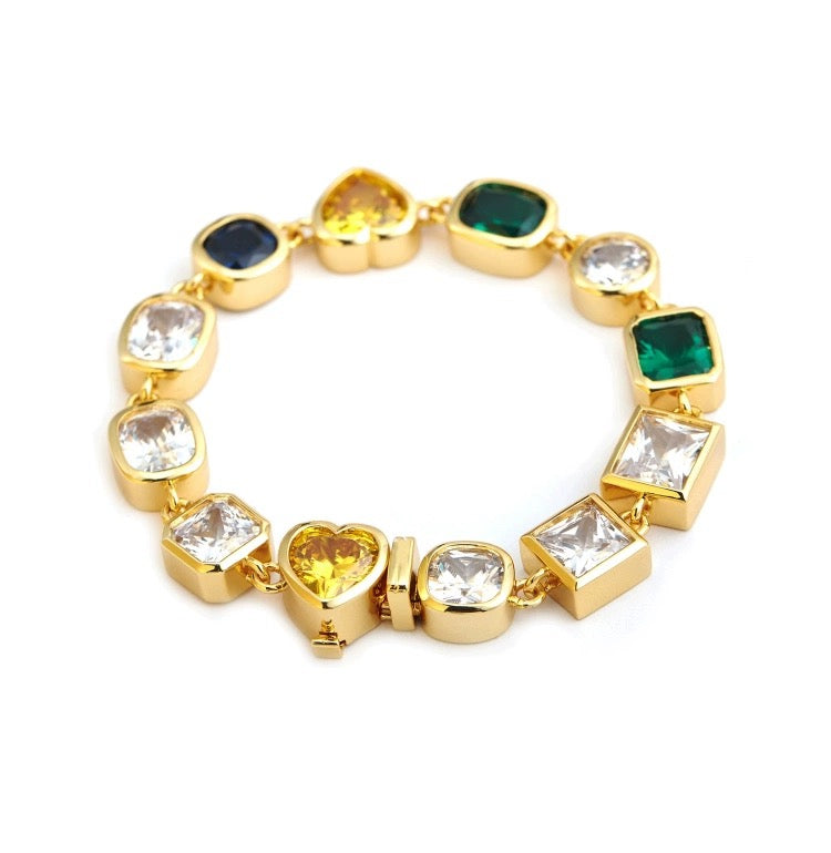 Pharrell Williams grills are studded with sapphires, rubies and emeralds. INFINITY GAUNTLETS jewelry diamond choker jacob & co short necklace gemstone heart Gabby Elan Jewelry infinity stone grillz grill grills