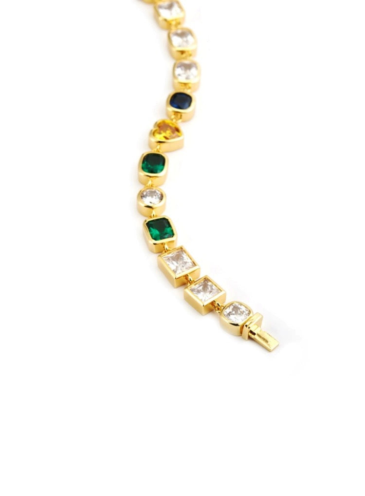 Pharrell Williams grills are studded with sapphires, rubies and emeralds. INFINITY GAUNTLETS jewelry diamond choker jacob & co short necklace gemstone heart Gabby Elan Jewelry infinity stone grillz grill grills