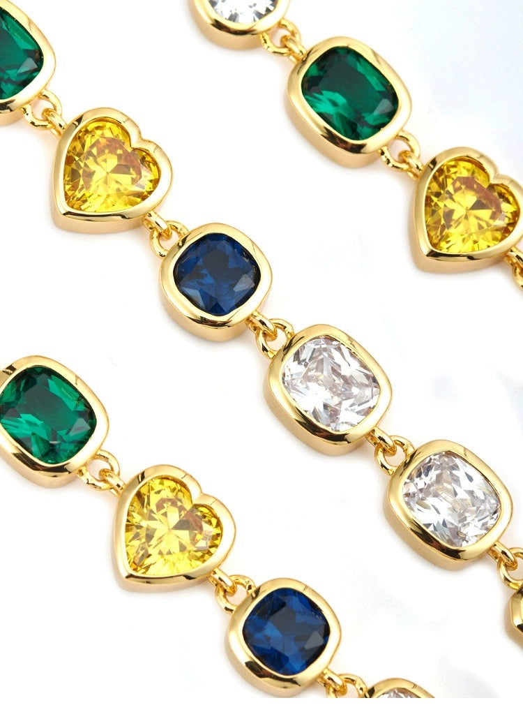 Pharrell Williams grills are studded with sapphires, rubies and emeralds. INFINITY GAUNTLETS jewelry diamond choker jacob & co short necklace gemstone heart Gabby Elan Jewelry infinity stone grillz grill grills