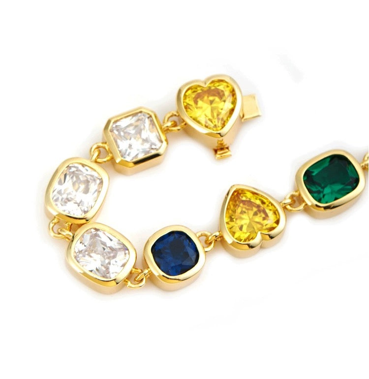 Pharrell Williams grills are studded with sapphires, rubies and emeralds. INFINITY GAUNTLETS jewelry diamond choker jacob & co short necklace gemstone heart Gabby Elan Jewelry infinity stone grillz grill grills