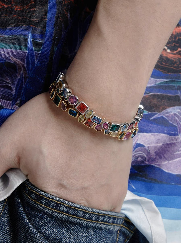 Pharrell Williams grills are studded with sapphires, rubies and emeralds. INFINITY GAUNTLETS jewelry diamond choker jacob & co short necklace gemstone heart Gabby Elan Jewelry infinity stone grillz grill grills