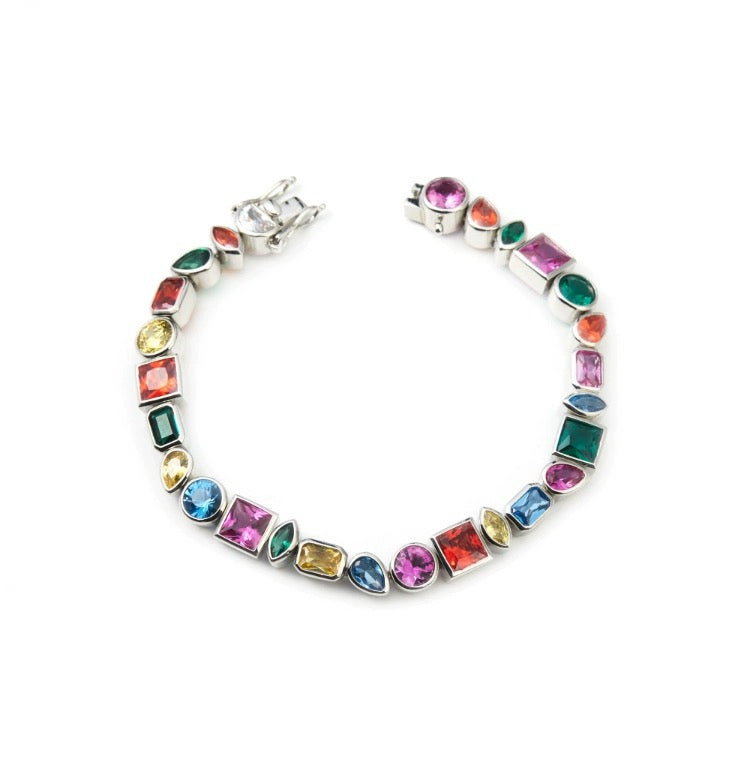 Pharrell Williams grills are studded with sapphires, rubies and emeralds. INFINITY GAUNTLETS jewelry diamond choker jacob & co short necklace gemstone heart Gabby Elan Jewelry infinity stone grillz grill grills