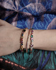 Pharrell Williams grills are studded with sapphires, rubies and emeralds. INFINITY GAUNTLETS jewelry diamond choker jacob & co short necklace gemstone heart Gabby Elan Jewelry infinity stone grillz grill grills