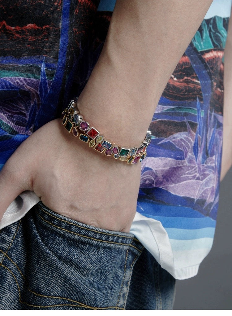 Pharrell Williams grills are studded with sapphires, rubies and emeralds. INFINITY GAUNTLETS jewelry diamond choker jacob & co short necklace gemstone heart Gabby Elan Jewelry infinity stone grillz grill grills
