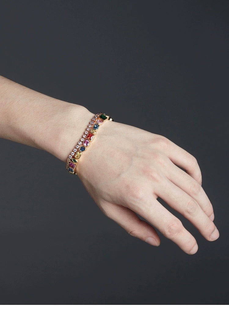 Pharrell Williams grills are studded with sapphires, rubies and emeralds. INFINITY GAUNTLETS jewelry diamond choker jacob & co short necklace gemstone heart Gabby Elan Jewelry infinity stone grillz grill grills