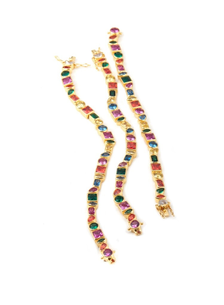 Pharrell Williams grills are studded with sapphires, rubies and emeralds. INFINITY GAUNTLETS jewelry diamond choker jacob & co short necklace gemstone heart Gabby Elan Jewelry infinity stone grillz grill grills