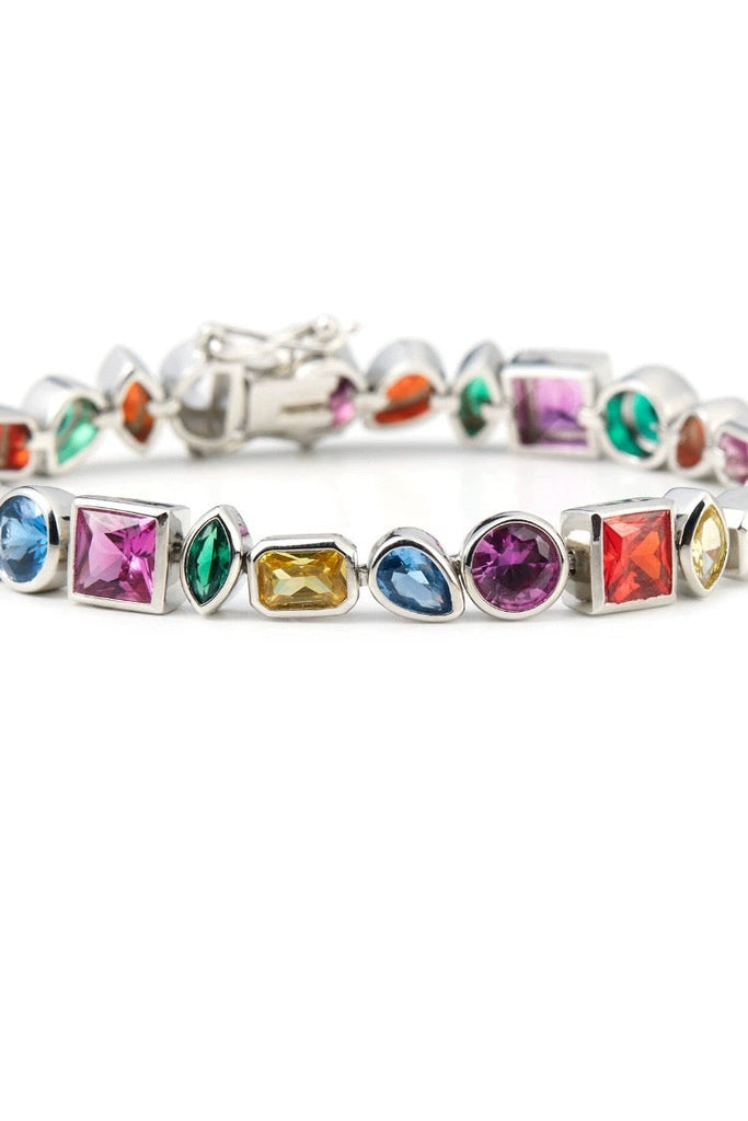 Pharrell Williams grills are studded with sapphires, rubies and emeralds. INFINITY GAUNTLETS jewelry diamond choker jacob & co short necklace gemstone heart Gabby Elan Jewelry infinity stone grillz grill grills