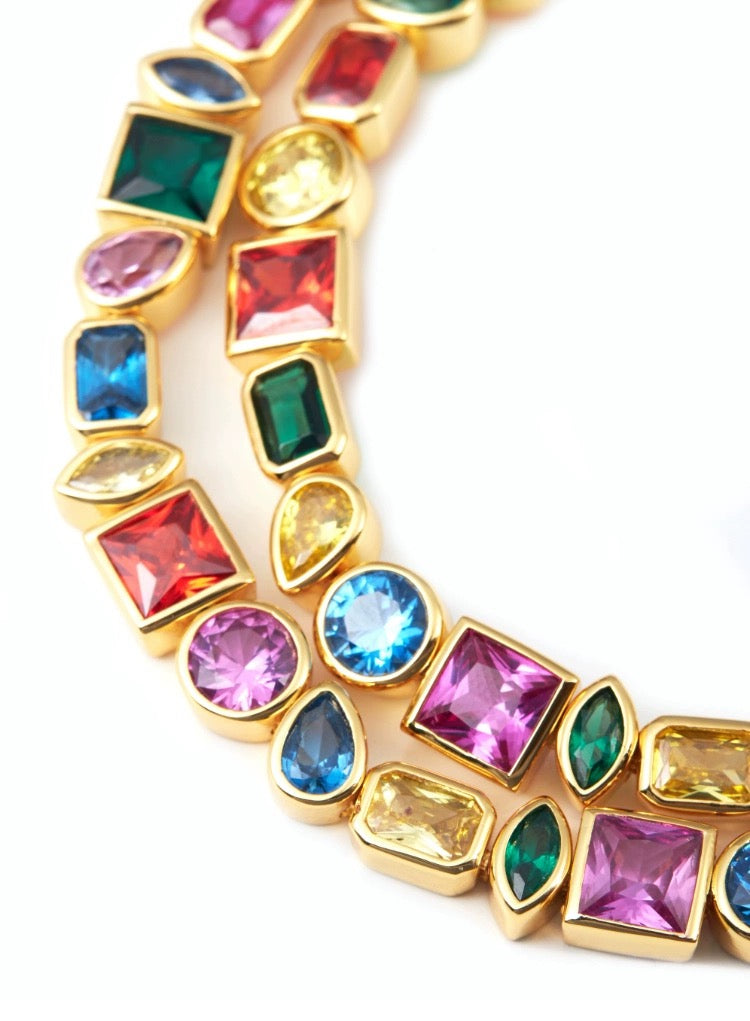 Pharrell Williams grills are studded with sapphires, rubies and emeralds. INFINITY GAUNTLETS jewelry diamond choker jacob & co short necklace gemstone heart Gabby Elan Jewelry infinity stone grillz grill grills