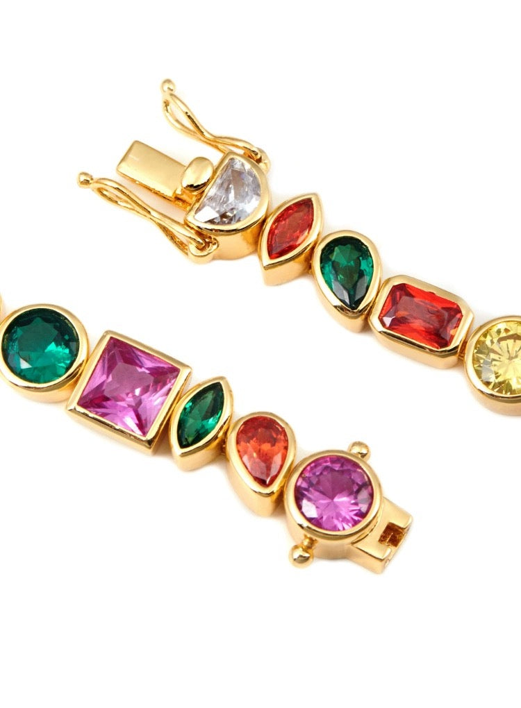 Pharrell Williams grills are studded with sapphires, rubies and emeralds. INFINITY GAUNTLETS jewelry diamond choker jacob & co short necklace gemstone heart Gabby Elan Jewelry infinity stone grillz grill grills