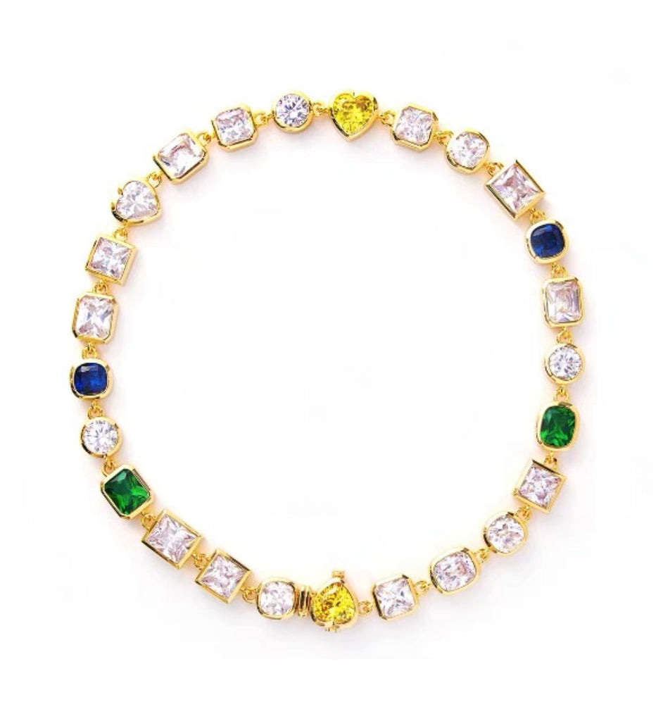 Pharrell Williams grills are studded with sapphires, rubies and emeralds. INFINITY GAUNTLETS jewelry diamond choker jacob & co short necklace gemstone heart  Gabby Elan Jewelry infinity stone grillz grill grills