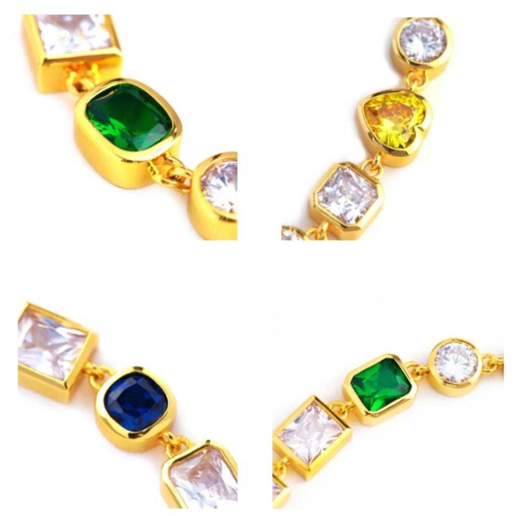 Pharrell Williams grills are studded with sapphires, rubies and emeralds. INFINITY GAUNTLETS jewelry diamond choker jacob & co short necklace gemstone heart Gabby Elan Jewelry infinity stone grillz grill grills