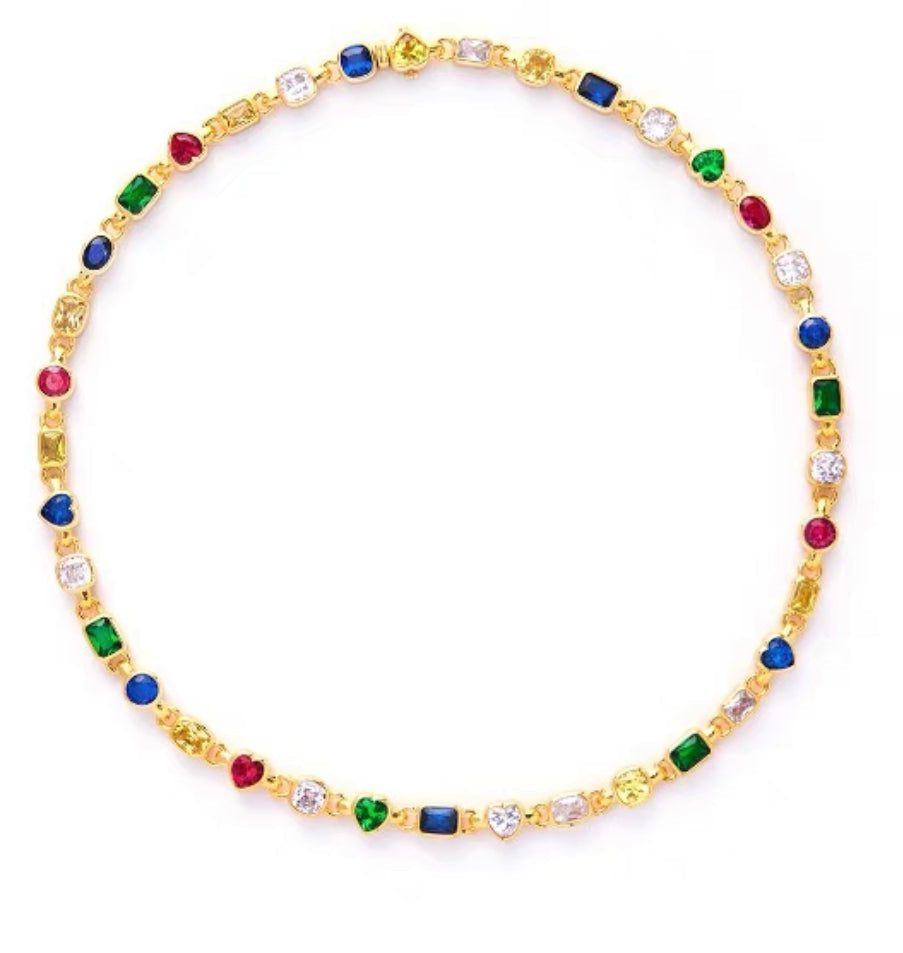 Pharrell Williams grills are studded with sapphires, rubies and emeralds. INFINITY GAUNTLETS jewelry diamond choker jacob & co short necklace gemstone heart Gabby Elan Jewelry infinity stone grillz grill grills