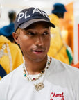 Pharrell Williams grills are studded with sapphires, rubies and emeralds. INFINITY GAUNTLETS jewelry diamond choker jacob & co short necklace gemstone heart Gabby Elan Jewelry infinity stone grillz grill grills