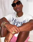 Pharrell Williams grills are studded with sapphires, rubies and emeralds. INFINITY GAUNTLETS jewelry diamond choker jacob & co short necklace gemstone heart Gabby Elan Jewelry infinity stone grillz grill grills