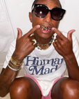 Pharrell Williams grills are studded with sapphires, rubies and emeralds. INFINITY GAUNTLETS jewelry diamond choker jacob & co short necklace gemstone heart Gabby Elan Jewelry infinity stone grillz grill grills