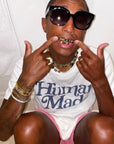 Pharrell Williams grills are studded with sapphires, rubies and emeralds. INFINITY GAUNTLETS jewelry diamond choker jacob & co short necklace gemstone heart Gabby Elan Jewelry infinity stone grillz grill grills
