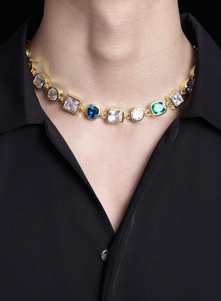 Pharrell Williams grills are studded with sapphires, rubies and emeralds. INFINITY GAUNTLETS jewelry diamond choker jacob & co short necklace gemstone heart Gabby Elan Jewelry infinity stone grillz grill grills