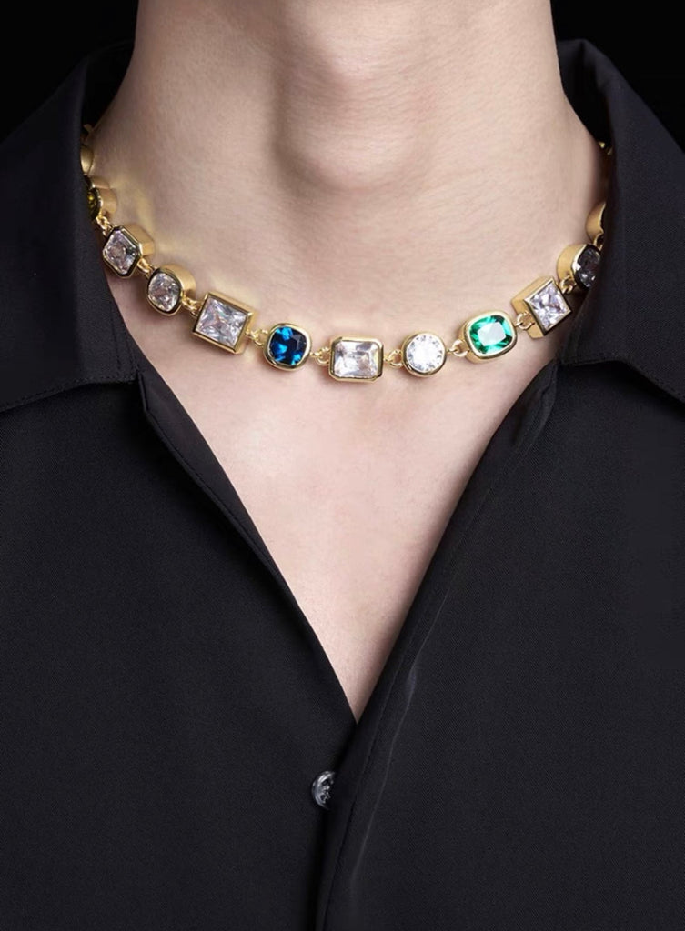 Pharrell Williams grills are studded with sapphires, rubies and emeralds. INFINITY GAUNTLETS jewelry diamond choker jacob & co short necklace gemstone heart Gabby Elan Jewelry infinity stone grillz grill grills