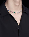 Pharrell Williams grills are studded with sapphires, rubies and emeralds. INFINITY GAUNTLETS jewelry diamond choker jacob & co short necklace gemstone heart Gabby Elan Jewelry infinity stone grillz grill grills