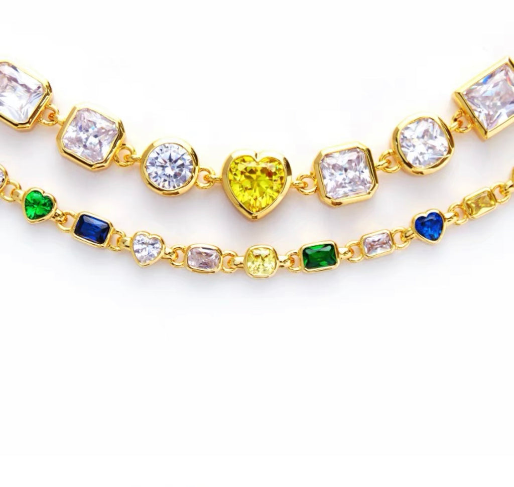 Pharrell Williams grills are studded with sapphires, rubies and emeralds. INFINITY GAUNTLETS jewelry diamond choker jacob & co short necklace gemstone heart Gabby Elan Jewelry infinity stone grillz grill grills