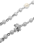 Travis Scott recently got pretty generous with his team, gifting his inner circle iced-out Takashi Murakami-designed chains from Eliantte