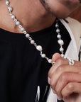 Travis Scott recently got pretty generous with his team, gifting his inner circle iced-out Takashi Murakami-designed chains from Eliantte