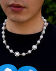 Travis Scott recently got pretty generous with his team, gifting his inner circle iced-out Takashi Murakami-designed chains from Eliantte