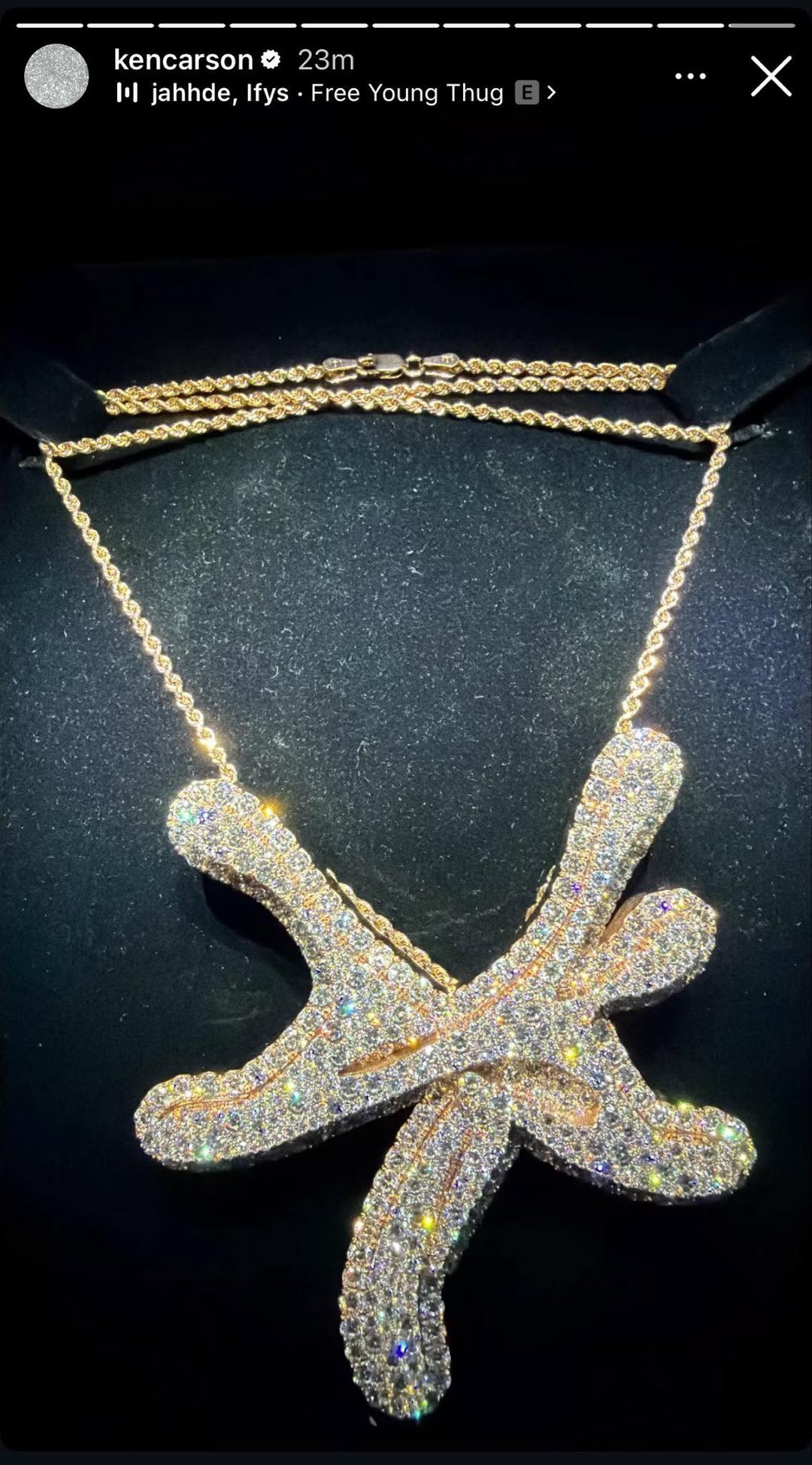 Young Thug gifted Ken Carson a custom, iced-out YSL chain featuring a diamond-covered pendant of the label's emblem.