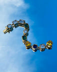 Pharrell Williams grills are studded with sapphires, rubies and emeralds. INFINITY GAUNTLETS jewelry diamond choker jacob & co short necklace gemstone heart Gabby Elan Jewelry infinity stone grillz grill grills