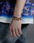 Pharrell Williams grills are studded with sapphires, rubies and emeralds. INFINITY GAUNTLETS jewelry diamond choker jacob & co short necklace gemstone heart Gabby Elan Jewelry infinity stone grillz grill grills