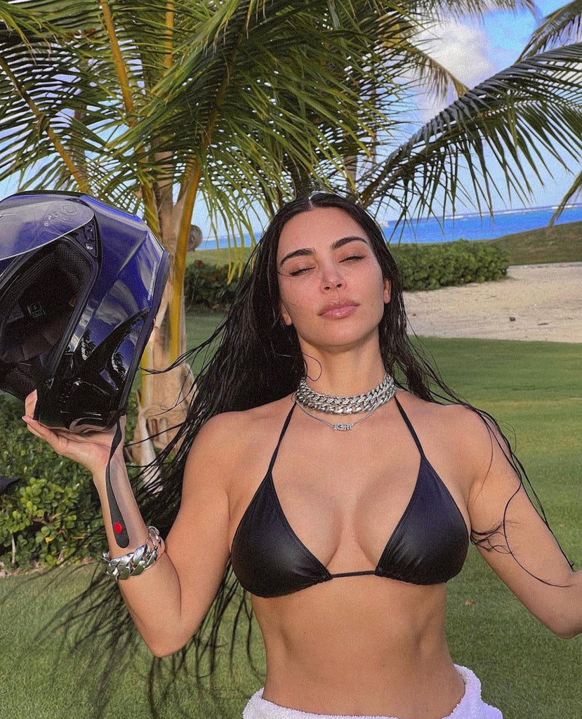 Kim Kardashian took to Instagram wearing a black leather bikini top, a motorcycle helmet, and no pants.