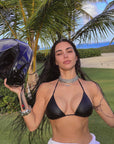 Kim Kardashian took to Instagram wearing a black leather bikini top, a motorcycle helmet, and no pants.