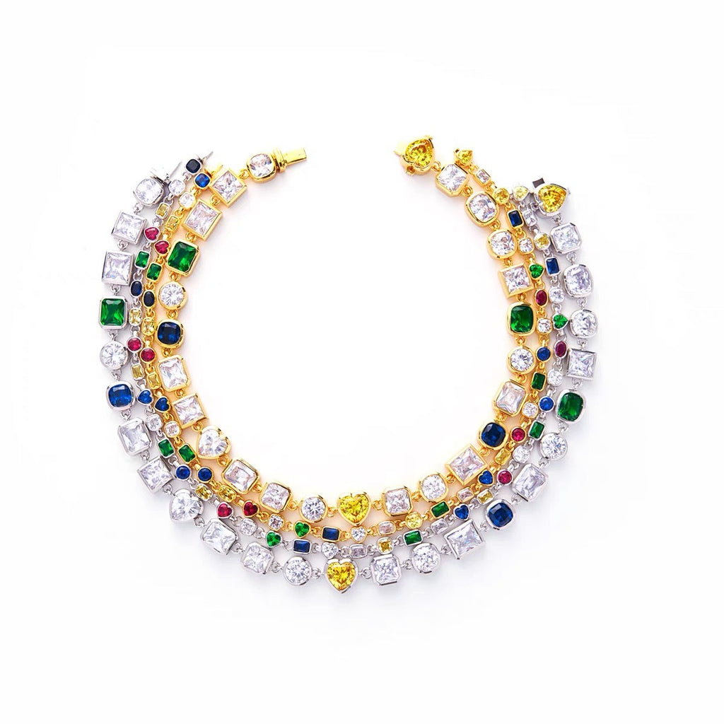 Pharrell Williams grills are studded with sapphires, rubies and emeralds. INFINITY GAUNTLETS jewelry diamond choker jacob & co short necklace gemstone heart Gabby Elan Jewelry infinity stone grillz grill grills