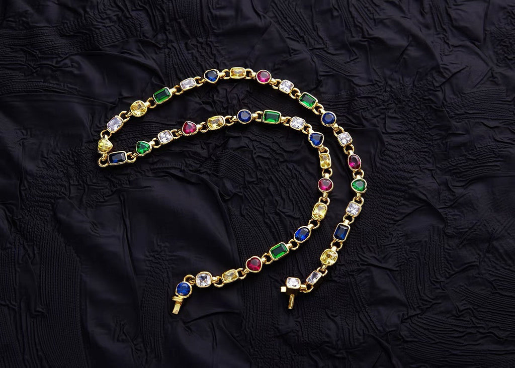 Pharrell Williams grills are studded with sapphires, rubies and emeralds. INFINITY GAUNTLETS jewelry diamond choker jacob & co short necklace gemstone heart Gabby Elan Jewelry infinity stone grillz grill grills