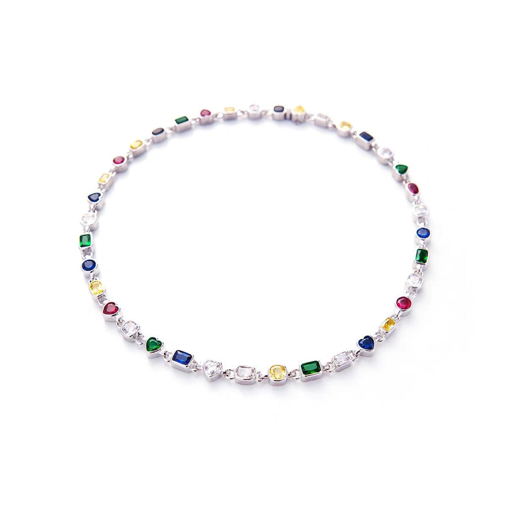 Pharrell Williams grills are studded with sapphires, rubies and emeralds. INFINITY GAUNTLETS jewelry diamond choker jacob & co short necklace gemstone heart Gabby Elan Jewelry infinity stone grillz grill grills