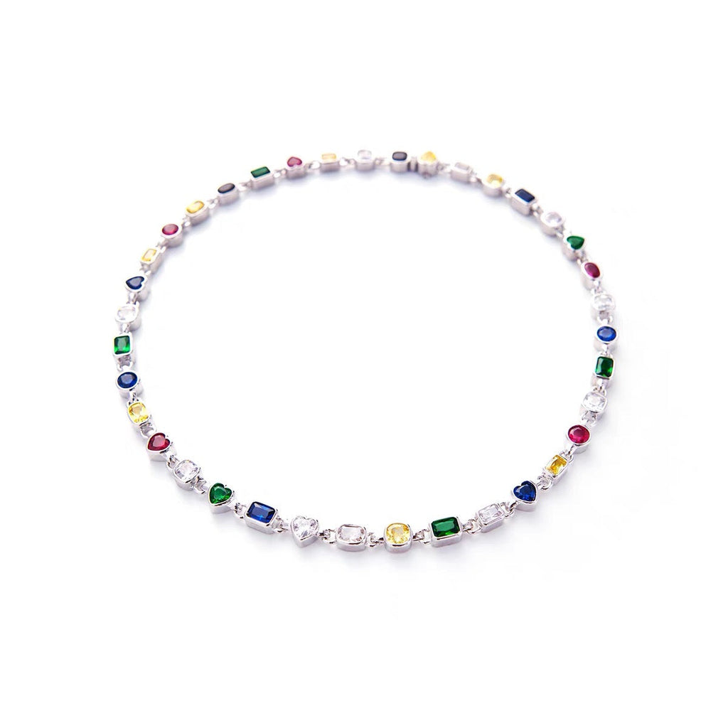 Pharrell Williams grills are studded with sapphires, rubies and emeralds. INFINITY GAUNTLETS jewelry diamond choker jacob & co short necklace gemstone heart Gabby Elan Jewelry infinity stone grillz grill grills