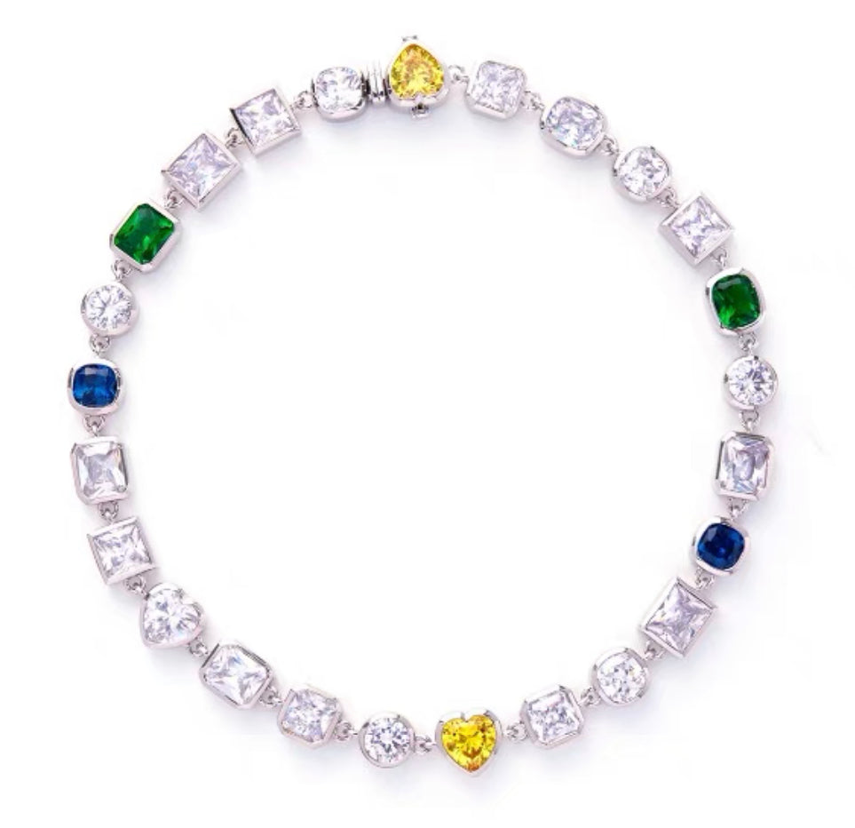 Pharrell Williams grills are studded with sapphires, rubies and emeralds. INFINITY GAUNTLETS jewelry diamond choker jacob &amp; co short necklace gemstone heart Gabby Elan Jewelry infinity stone grillz grill grills