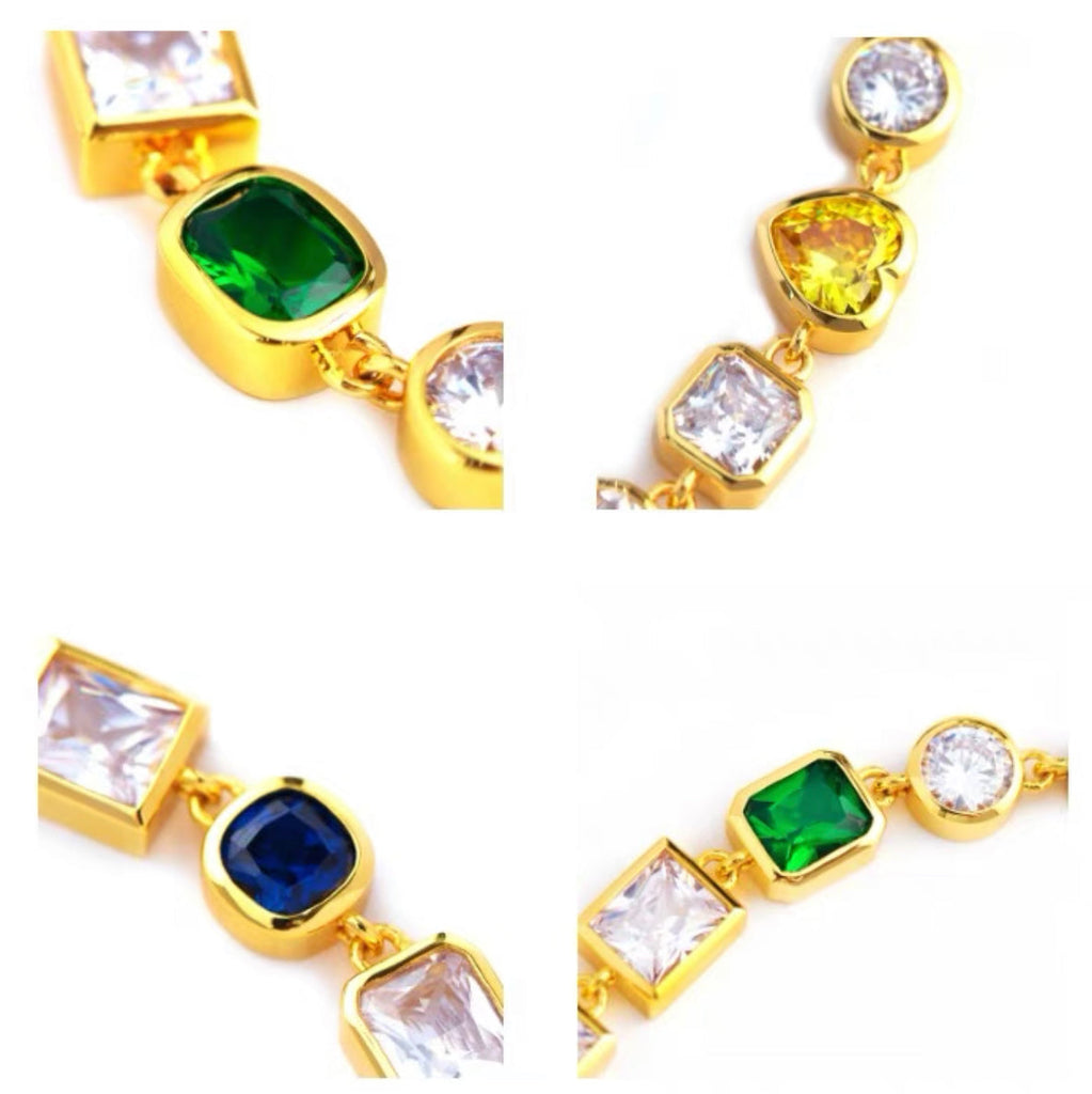 Pharrell Williams grills are studded with sapphires, rubies and emeralds. INFINITY GAUNTLETS jewelry diamond choker jacob & co short necklace gemstone heart Gabby Elan Jewelry infinity stone grillz grill grills