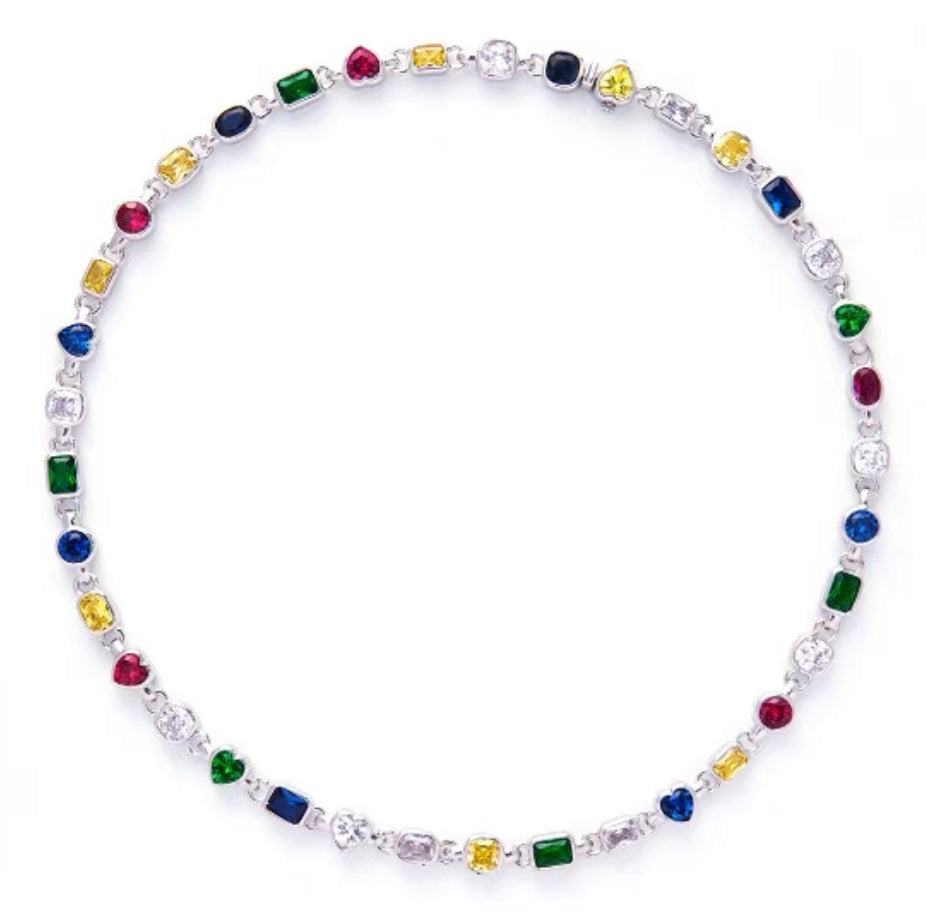 Pharrell Williams grills are studded with sapphires, rubies and emeralds. INFINITY GAUNTLETS jewelry diamond choker jacob & co short necklace gemstone heart Gabby Elan Jewelry infinity stone grillz grill grills