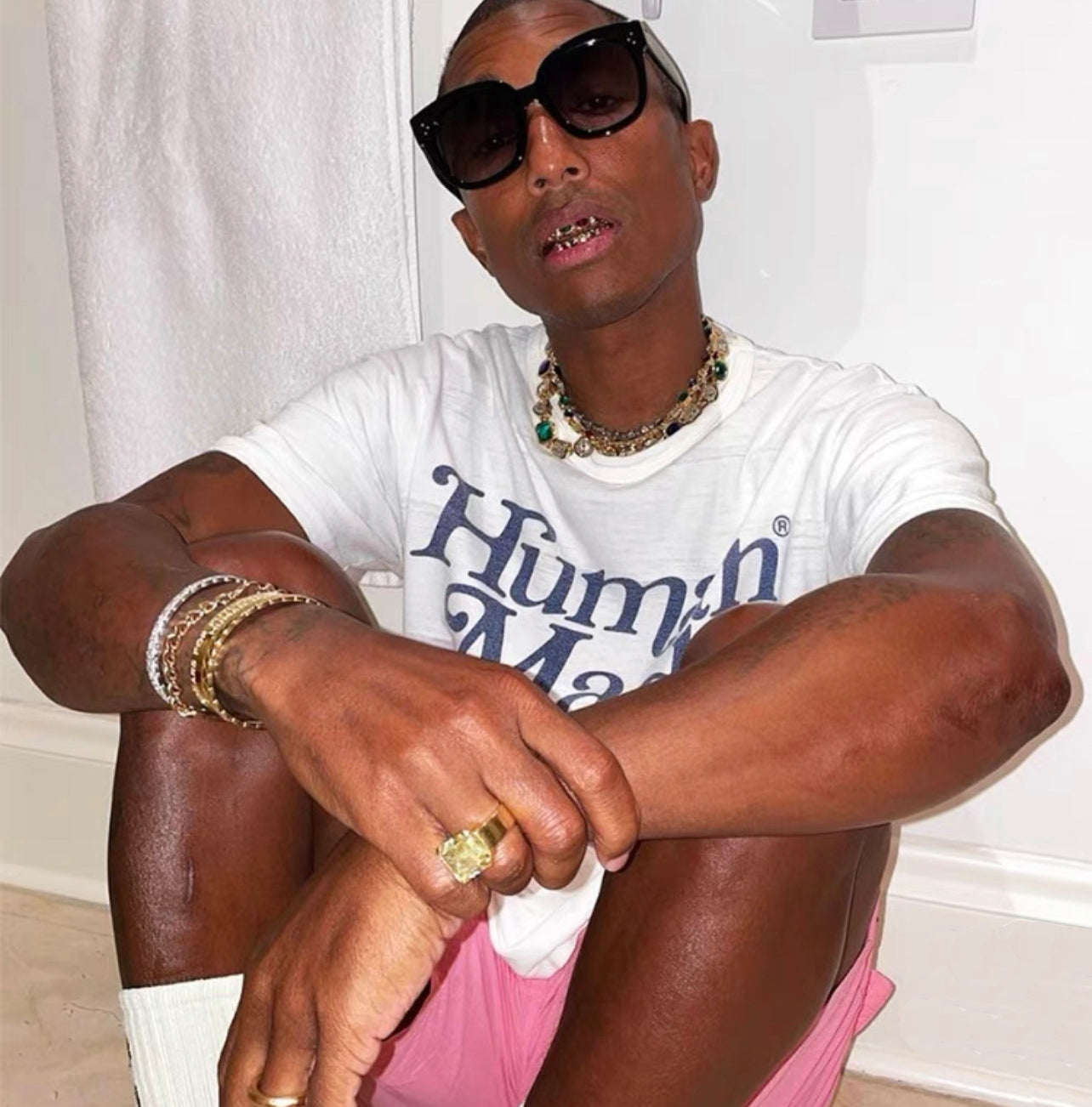 Pharrell Williams grills are studded with sapphires, rubies and emeralds. INFINITY GAUNTLETS jewelry diamond choker jacob &amp; co short necklace gemstone heart Gabby Elan Jewelry infinity stone grillz grill grills