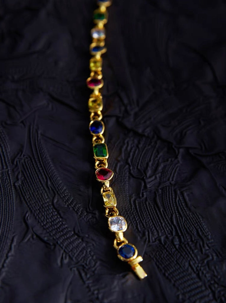 Pharrell Williams grills are studded with sapphires, rubies and emeralds. INFINITY GAUNTLETS jewelry diamond choker jacob & co short necklace gemstone heart Gabby Elan Jewelry infinity stone grillz grill grills