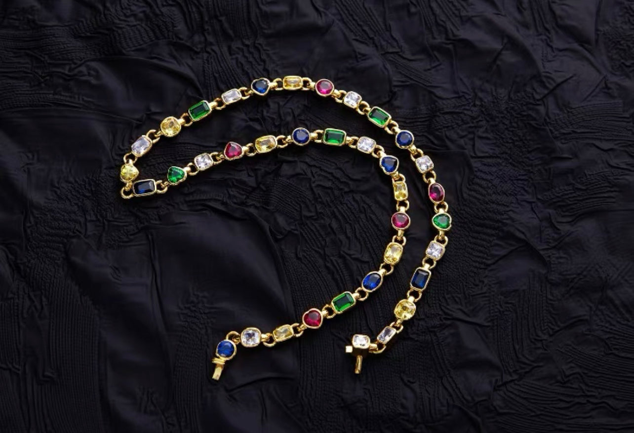 Pharrell Williams grills are studded with sapphires, rubies and emeralds. INFINITY GAUNTLETS jewelry diamond choker jacob &amp; co short necklace gemstone heart Gabby Elan Jewelry infinity stone grillz grill grills
