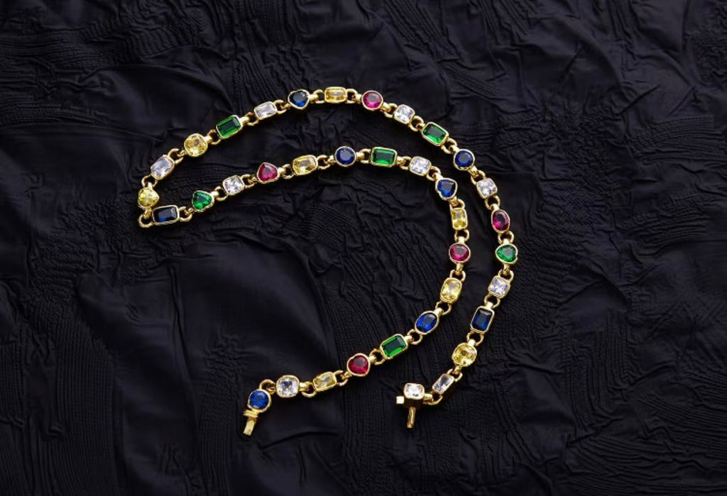 Pharrell Williams grills are studded with sapphires, rubies and emeralds. INFINITY GAUNTLETS jewelry diamond choker jacob & co short necklace gemstone heart Gabby Elan Jewelry infinity stone grillz grill grills