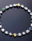Pharrell Williams grills are studded with sapphires, rubies and emeralds. INFINITY GAUNTLETS jewelry diamond choker jacob & co short necklace gemstone heart Gabby Elan Jewelry infinity stone grillz grill grills