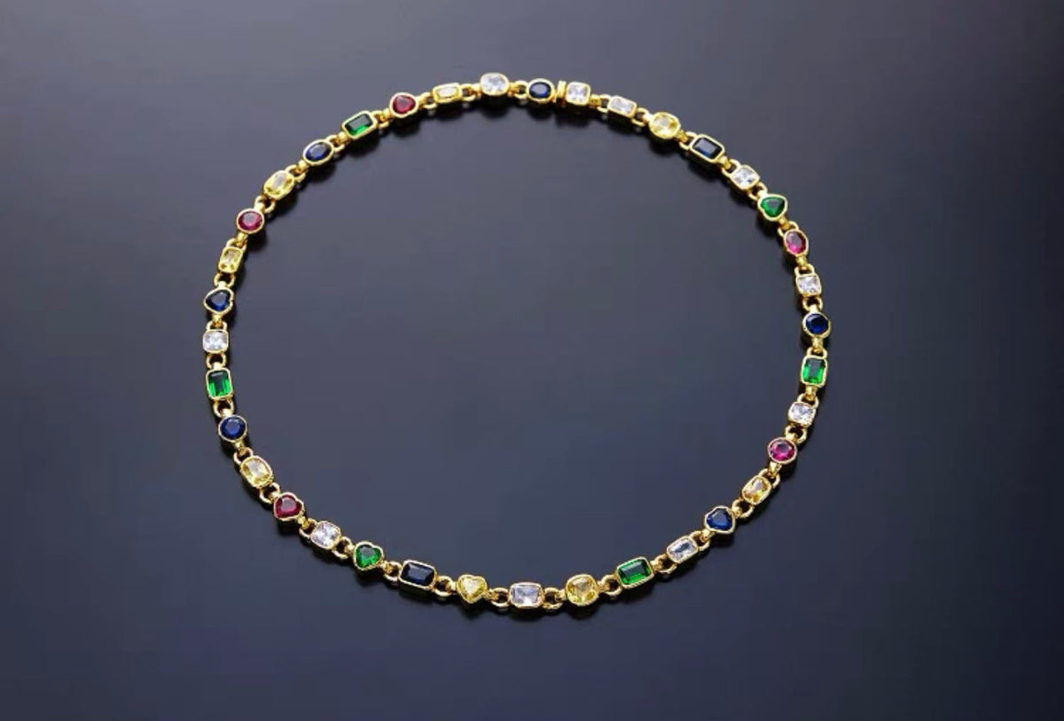 Pharrell Williams grills are studded with sapphires, rubies and emeralds. INFINITY GAUNTLETS jewelry diamond choker jacob &amp; co short necklace gemstone heart Gabby Elan Jewelry infinity stone grillz grill grills