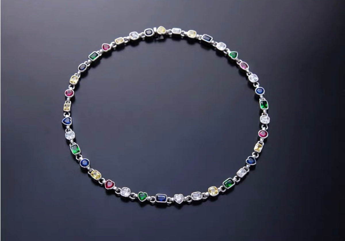 Pharrell Williams grills are studded with sapphires, rubies and emeralds. INFINITY GAUNTLETS jewelry diamond choker jacob &amp; co short necklace gemstone heart Gabby Elan Jewelry infinity stone grillz grill grills